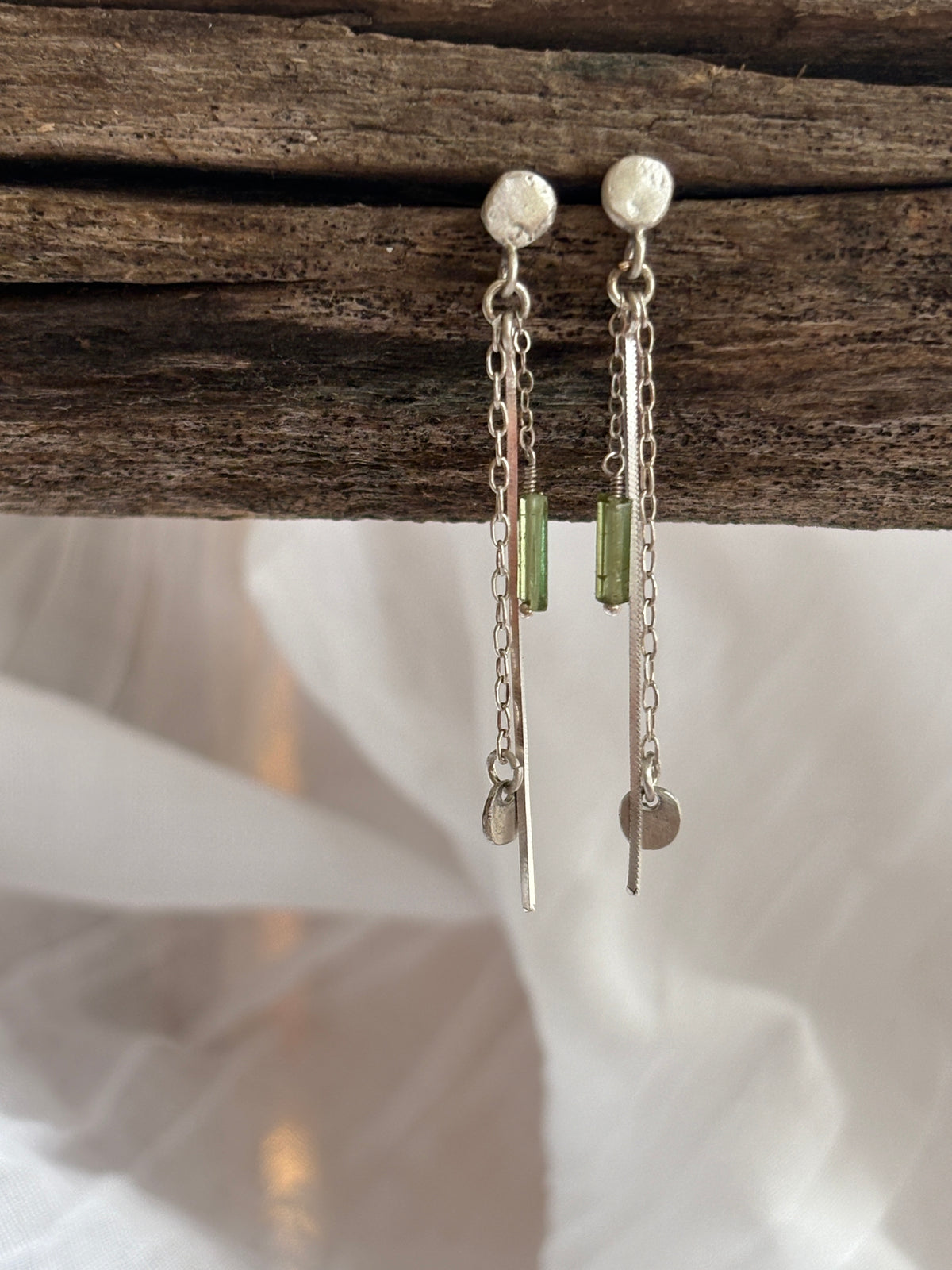 cascade. rustic sterling silver stud earrings with green tourmaline crystals and long linear sterling chain accents.