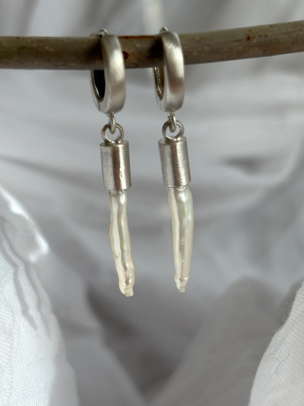 palisades.  white freshwater toothpick pearls with sterling silver huggie hoops.