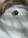 growth.  a hexagonal pink sapphire slice set in sterling silver. permanent jewelry connector or custom bracelet.